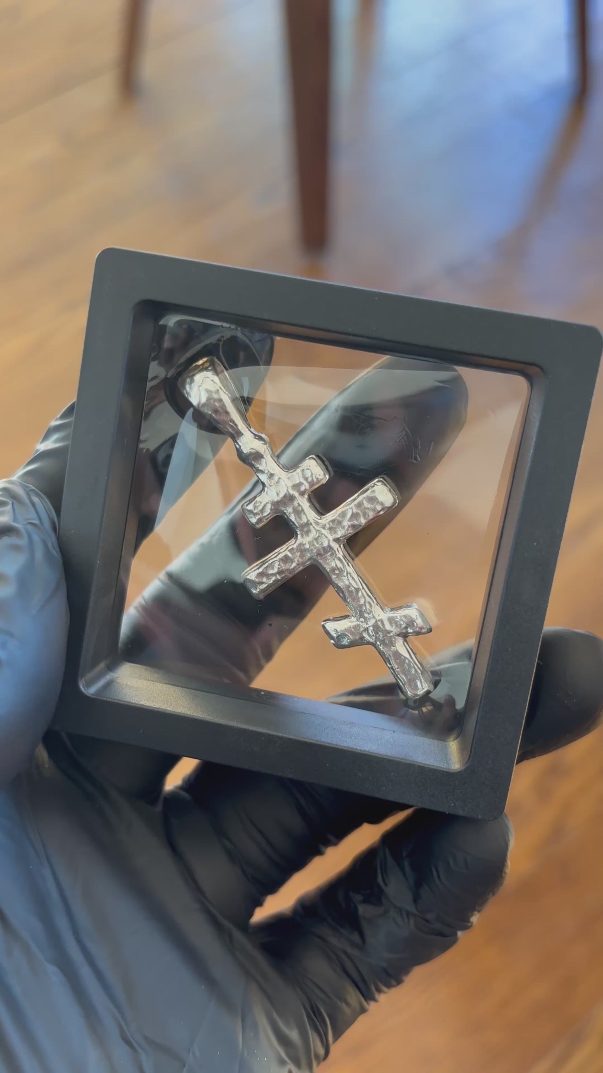 Hand-cast silver Orthodox Cross pendant shown in hand, real video